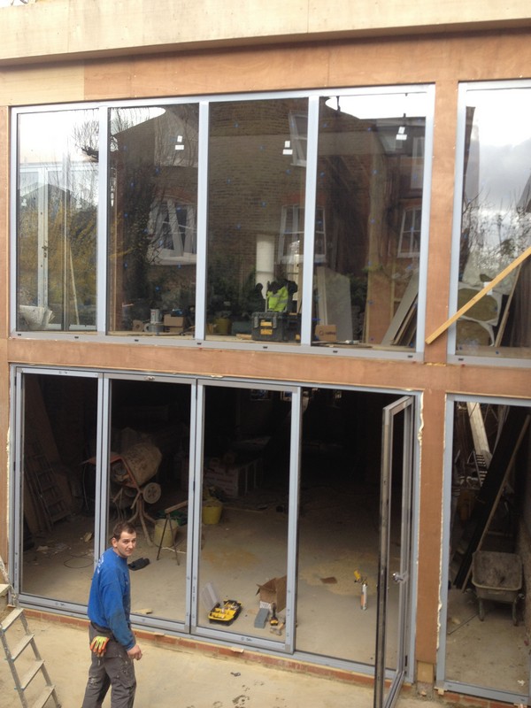 Aluminium bi-fold doors with two-storey glazing in Watford
