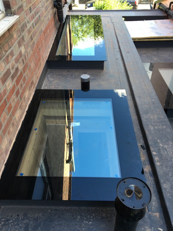 Multiple flat roof skylights on extension in Watford