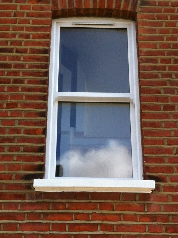 uPVC sash window on Victorian red brick house in Watford